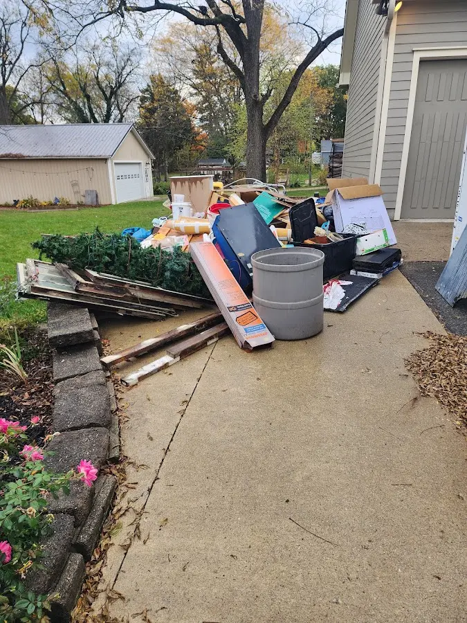 Dumpster being loaded with debris for Estate Cleanout Dumpster Rental in Valley